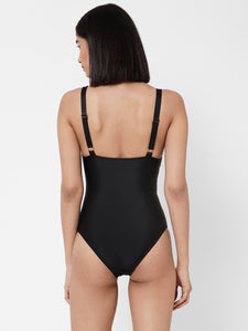 Esha Lal Swimwear one piece black swimsuit with cutouts and gold ring