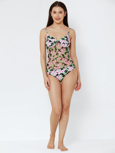 woman wearing Esha Lal swimwear one piece swimsuit with mesh and flower print