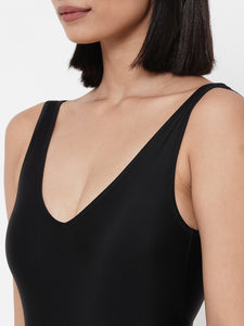 woman wearing Esha Lal swimwear black one piece swimsuit