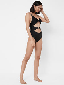 Esha Lal Swimwear one piece black swimsuit with cutouts and gold ring