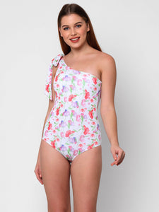women wearing one piece one shoulder swimsuit with bow on shoulder. Sweet pea flower print on white background.