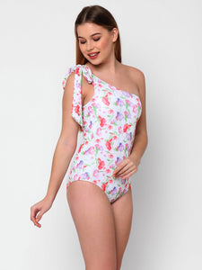 women wearing one piece one shoulder swimsuit with bow on shoulder. Sweet pea flower print on white background.